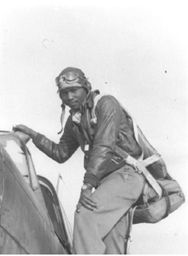 Herman “Ace” Lawson climbing into his P-40 Warhawk